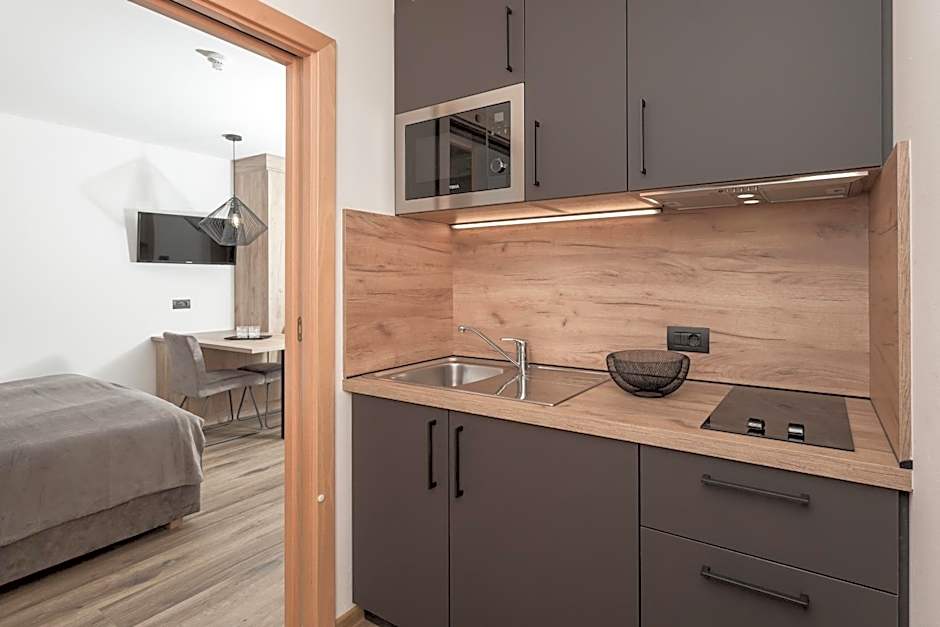 Aparthotel Familiaris - Family Apartments - Pools & Spa in Dolomites