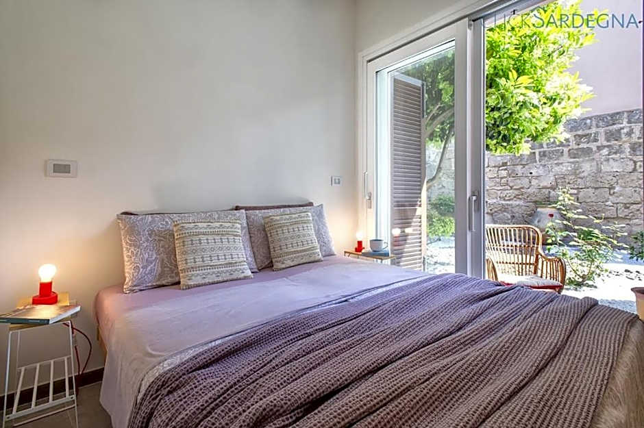 ClickSardinia Alghero Spectacular waterfront Neptune apartment with sea-facing terraces and garden