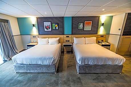 Family Queen Room with Two Queen Beds and Sofa Bed