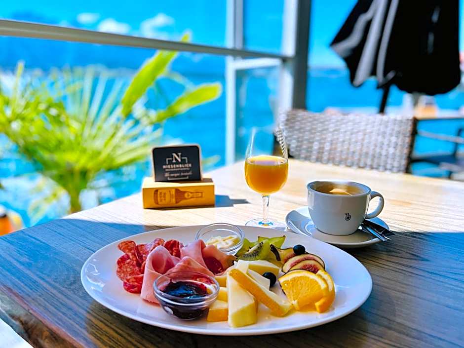 Boutique Hotel Niesenblick - direkt am Thunersee gelegen mit SELF CHECK IN & digitaler Rezeption