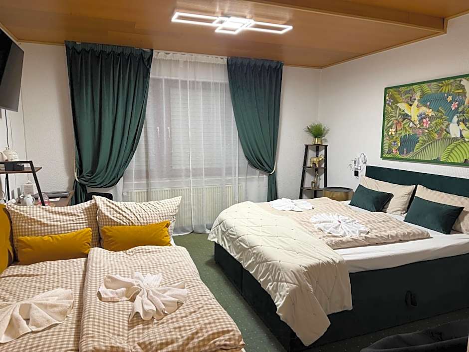 Photo 1 of 8 of Triple Room with Private Bathroom