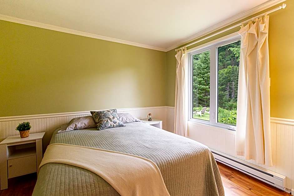 Tranquil Riverfront Chalet with Hot Tub