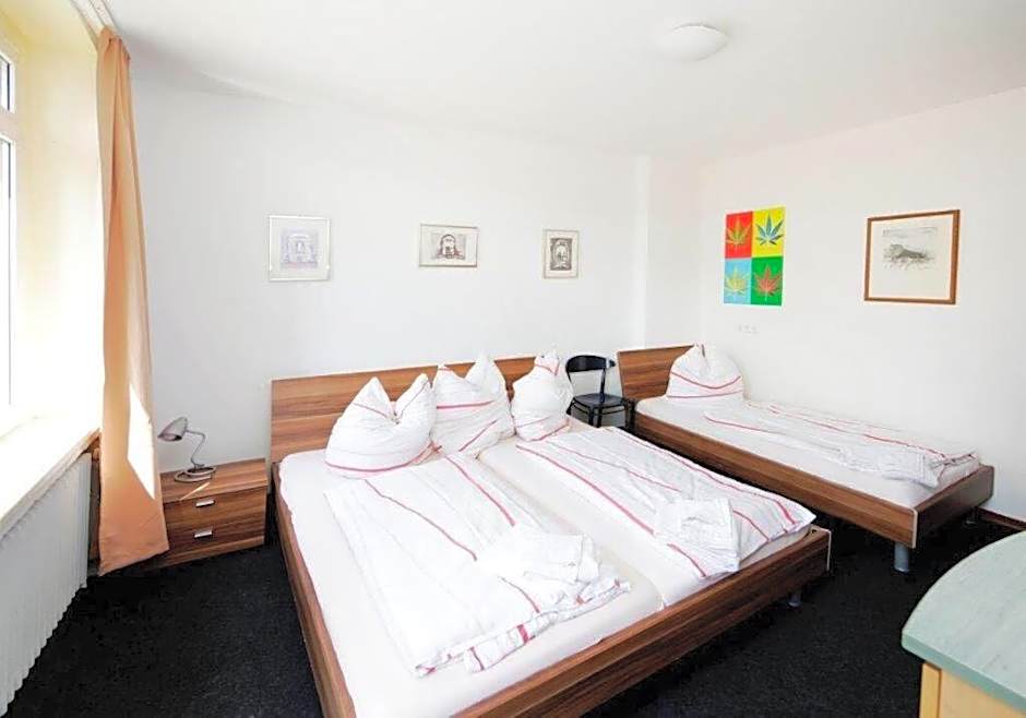 Photo 1 of 7 of Triple Room with Shared Bathroom