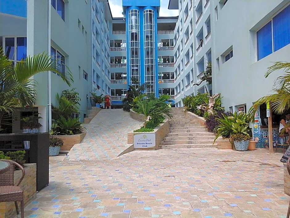 Cowrie Shell Beach Apartments Official