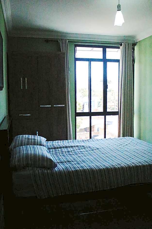 Paradise Hostel e Flats