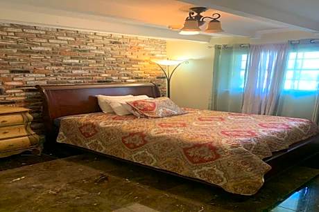 Queen Bed with Shared Bathroom