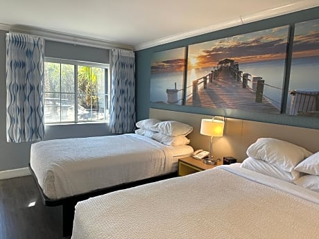 Room with One King and Two Double Beds with Bath Tub - Mobility Accessible/Non-Smoking