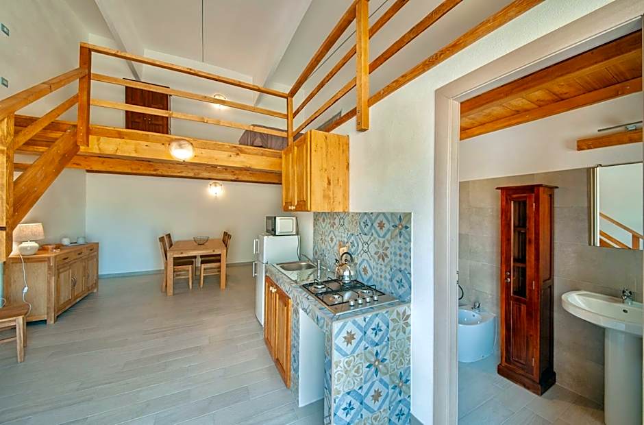 Lofts with private outdoor area and swimming-pool in Badesi