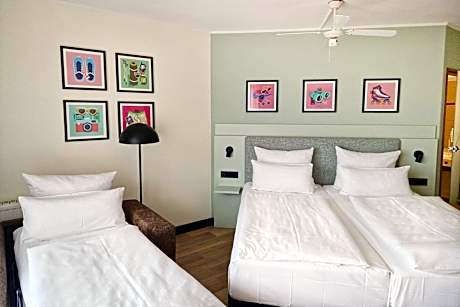 Standard Family Room with One Queen Bed and One Sofa Bed