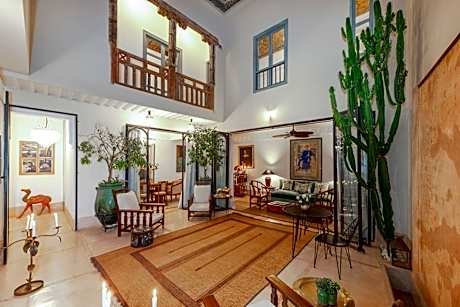 Riad Le J