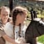 Aparthotel Familiaris - Family Apartments - Pools & Spa in Dolomites