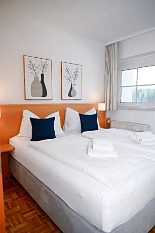 Three-Bedroom Apartment with Balcony and Lake View