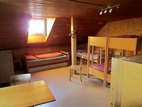 Single Bed in Dormitory Room with Shared Bathroom