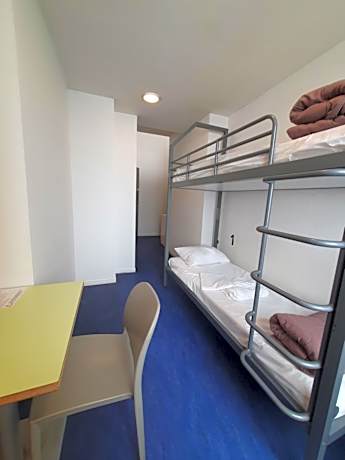 Room with 2 bunk beds and bathroom