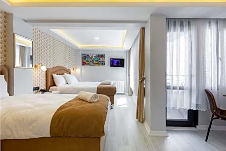 Deluxe Quadruple Suite with Sea View Balcony.