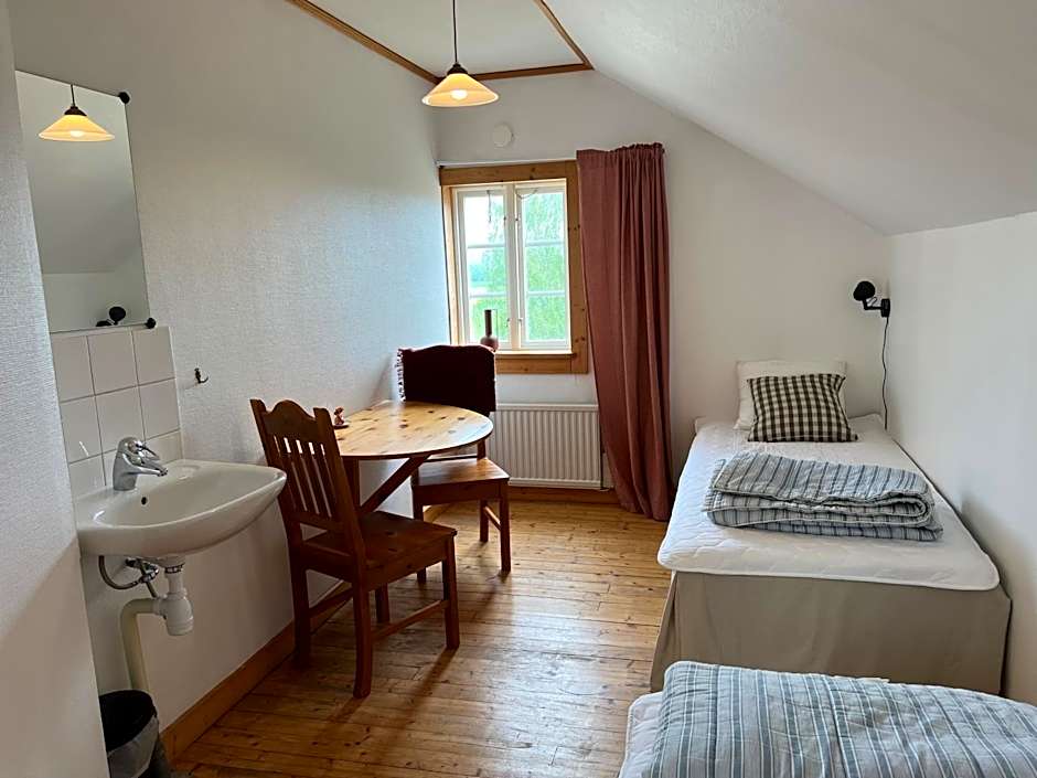 Photo 1 of 10 of Standard Twin Room with Shared Bathroom