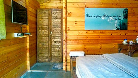 Deluxe AC Wooden Cottage Garden View
