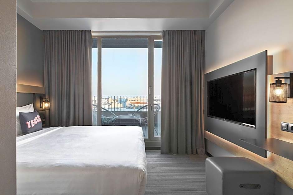 Photo 1 of 3 of Superior 1 Queen Bed Guestroom, Downtown View, Balcony
