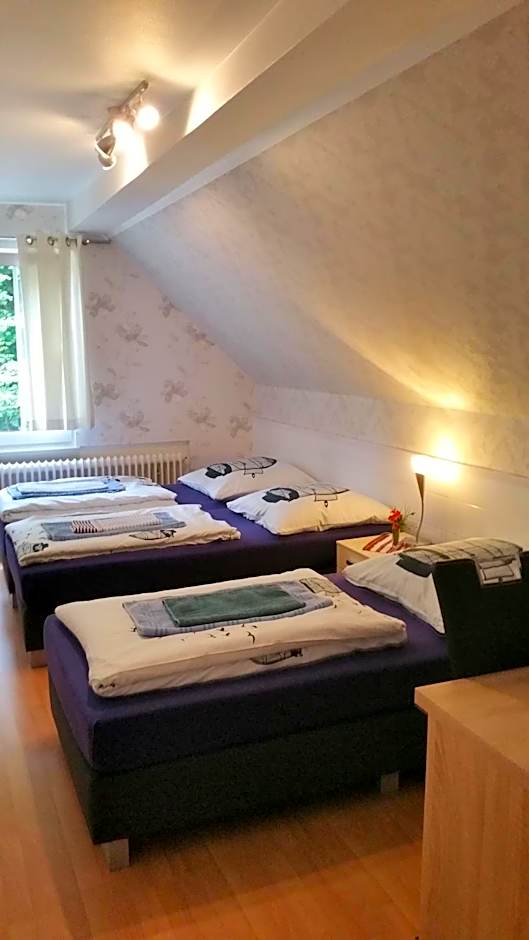 Photo 1 of 8 of Triple Room with Bathroom