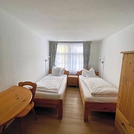 Standard Twin Room with external shared WC and Shower