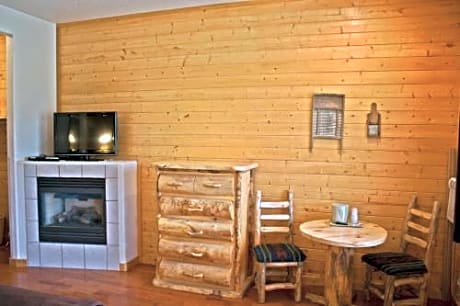 Queen Bed with Fireplace and  Parking lot view