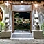 EHOA NYANYI BEACH Boutique Hotel - In front of entrance to NUANU