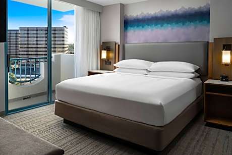 One Bedroom King Suite with Sofa, City View and Balcony