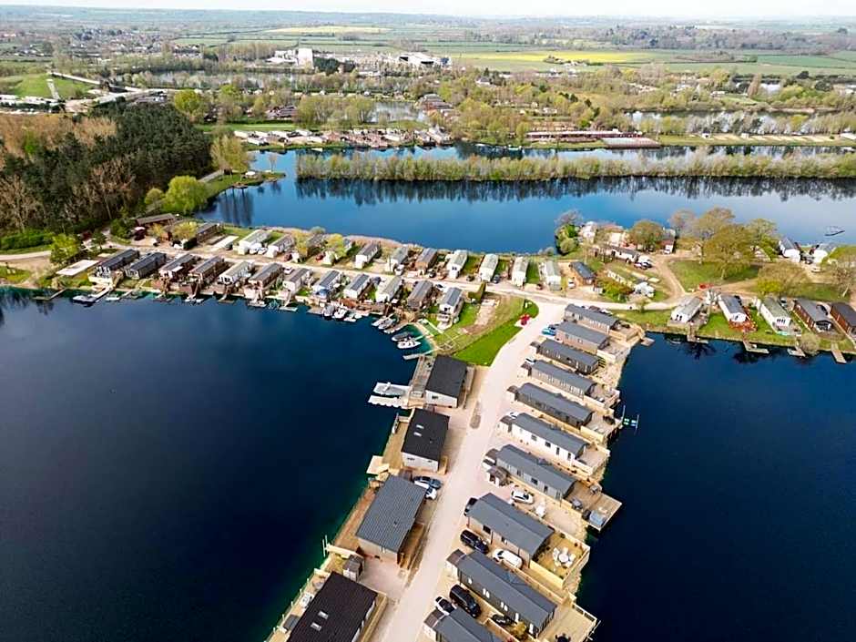 Award winning Serenity Lodge with outstanding lakeside views from the hot tub , at Tallington Lakes Leisure Park, Stamford