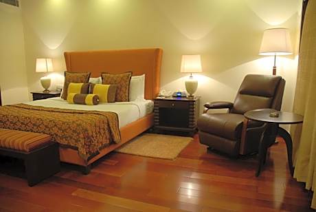 Luxury One-Bedroom Suite With Complimentary Airport Transfers  (Complimentary Welcome Drink on arrival,15% off on session of couple's Spa,15% off on session of couple's Spa, 15% off on Food & Beverage services, 15% Off on Laundry service for upto 20 items