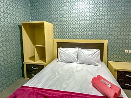 Tini's Guest House Malang Mitra RedDoorz