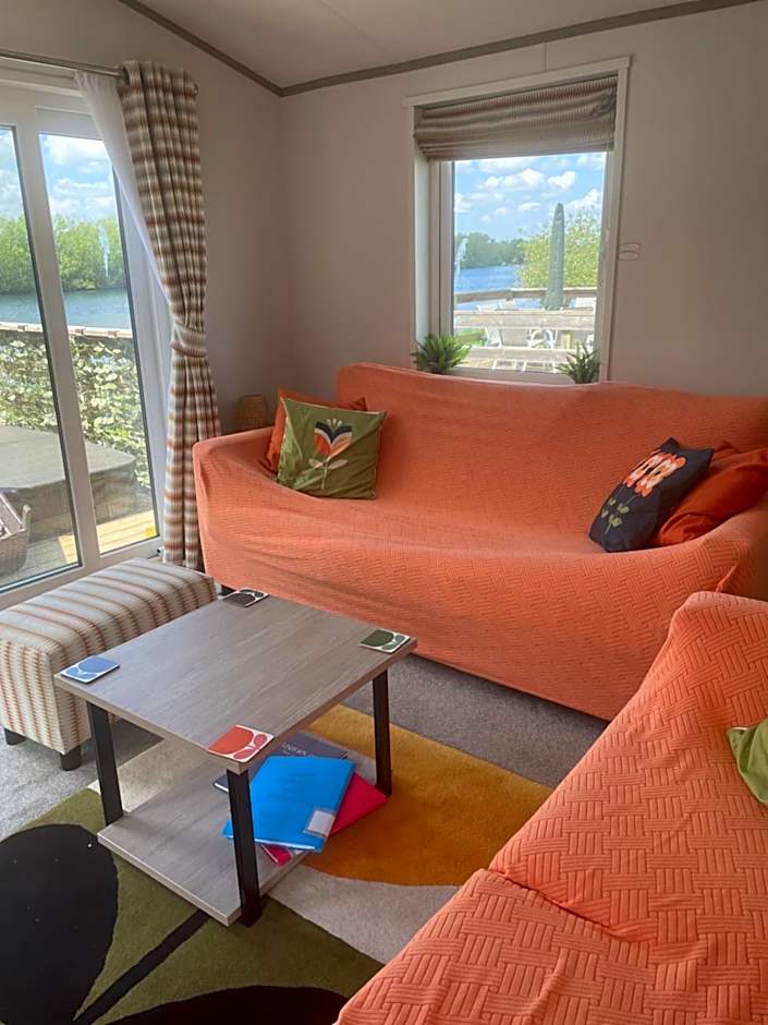 Award winning Serenity Lodge with outstanding lakeside views from the hot tub , at Tallington Lakes Leisure Park, Stamford