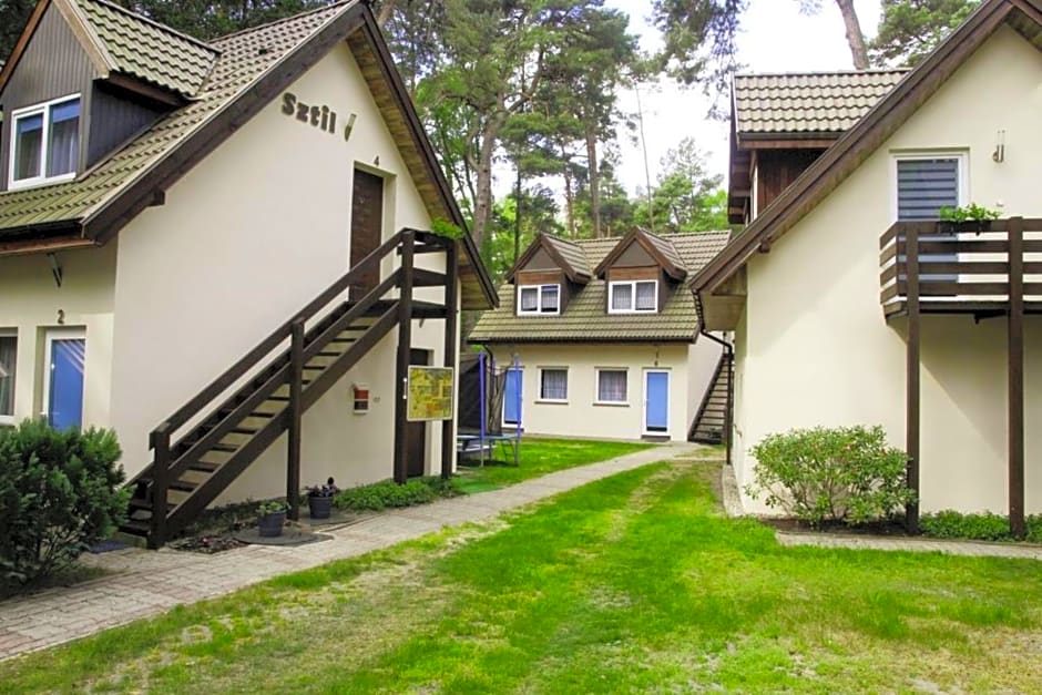 Sztil - Apartamenty i drewniane domki