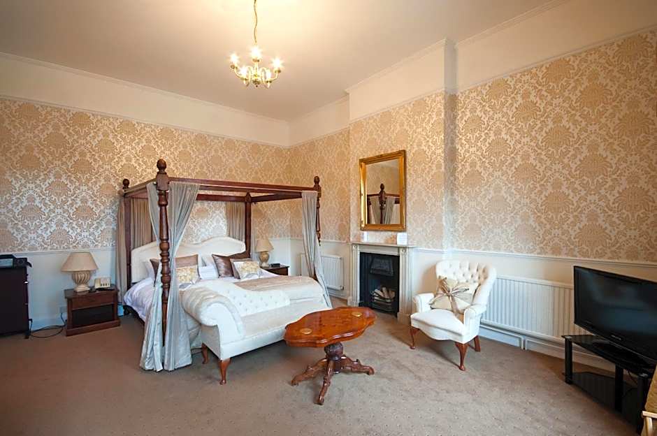 Photo 1 of 2 of Four Poster Room
