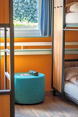 Bed in 6-Bed Dormitory Room with Shared Bathroom