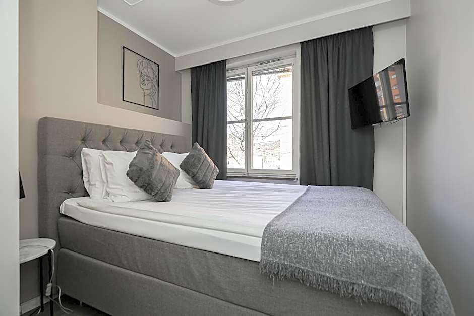 Photo 1 of 5 of Compact Room (55 in bed)