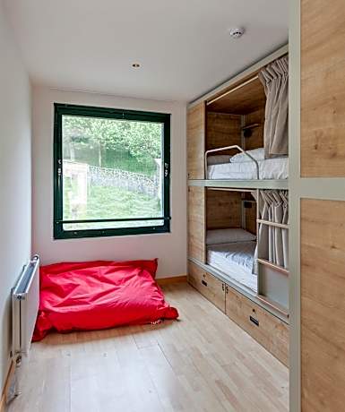 Bed in 8-Bed Dormitory Room with Shared Bathroom