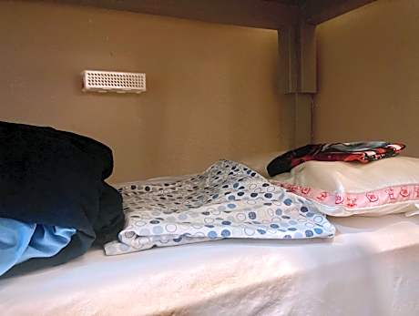 Single Bed in Dormitory Room