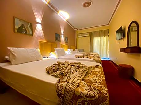 Deluxe Quadruple Room with Balcony